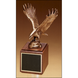 Fully modeled antique bronze eagle casting on a walnut base.