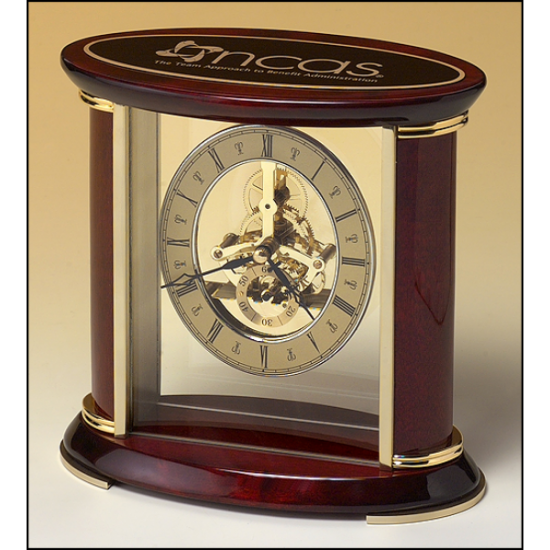 Skeleton clock with sub-second dial, brass finished movement and rosewood piano finish accents