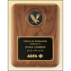 American walnut plaque with a finely detailed black and gold eagle medallion